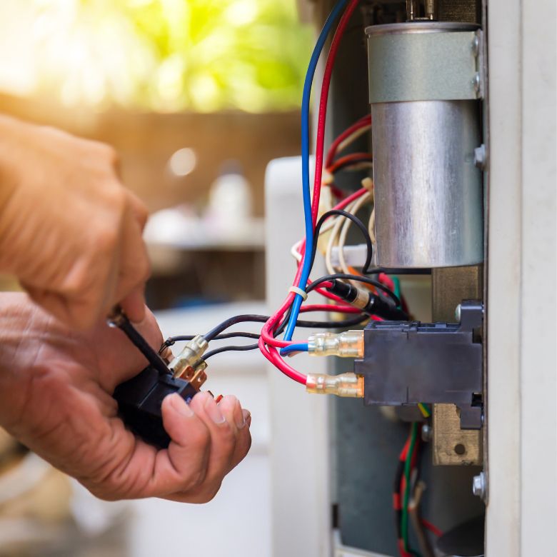 hands fixing a switch