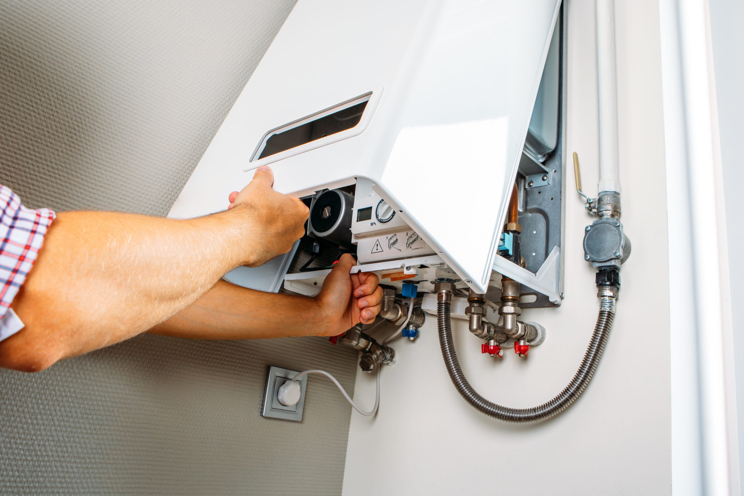 Technician working on boiler