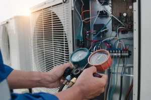 technician using a device to conduct ac repair