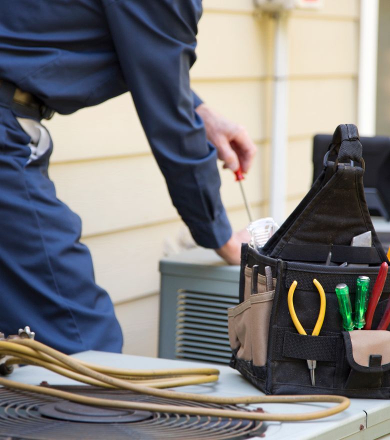 Technician working on hvac unit